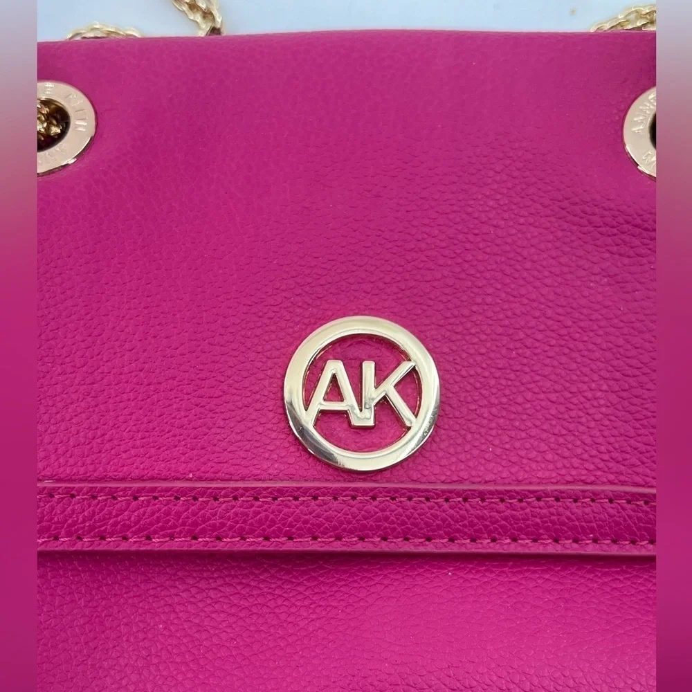 Anne Klein hot pink crossbody bag with gold chain strap and front flap w/ emblem